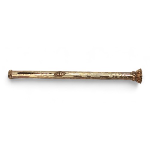 277 - An antique yellow metal, tests as 9ct gold or above, propelling pencil, with floral moulded sliding ... 