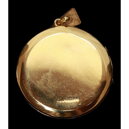 288 - A 9ct gold pendant locket, circular form with two phot-frames, foliate-engraved front, 7.5g