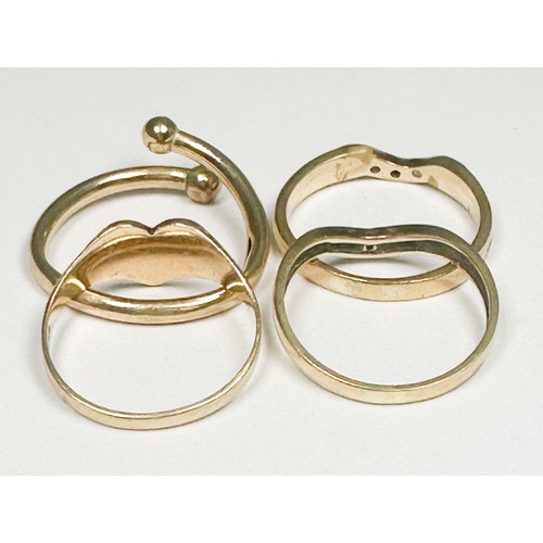 302 - Four various 9ct gold rings, including two diamond set wishbone rings, etc, total weight 6.3 grams.