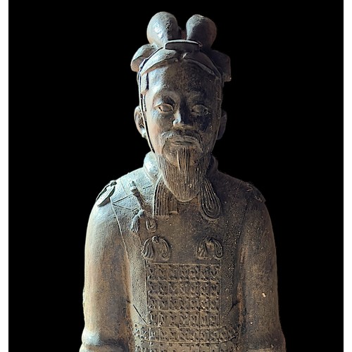 479 - A stone-carved figure of a Terracotta Warrior, on pedestal base, 133cm high