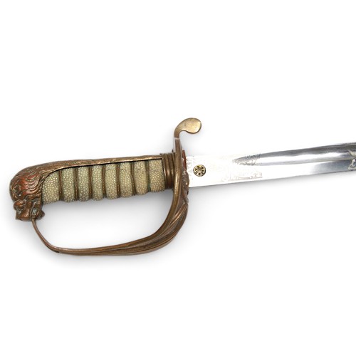 602 - A Royal Naval officer's Dress Sword, with 31-inch single-edge steel blade with spear tip and 2/3 ful... 