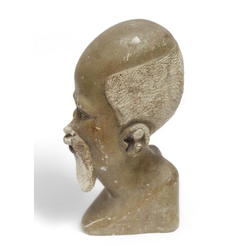 700 - An African carved 'Wishing Stone' bust of a native with beard, 33cm high