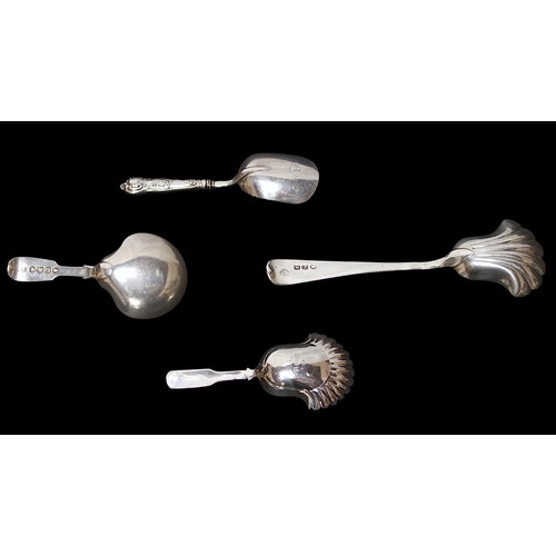 186 - Four various early 19th Century silver caddy spoons, including an example with shell shaped bowl by ... 