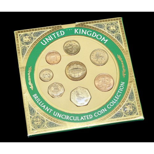 503 - Two coins sets including a Royal Mint Brilliant uncirculated coin collection with some bronze exampl... 