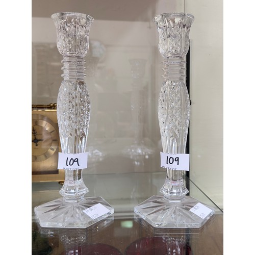 109 - A pair of Waterford Crystal candlesticks, 25cm tall, together with a boxed Waterford Crystal 'Metrop... 