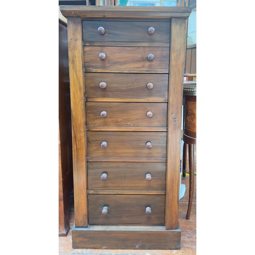 727 - A 19th century walnut Wellington chest of seven drawers with turned pulls and hinged locking pilaste... 