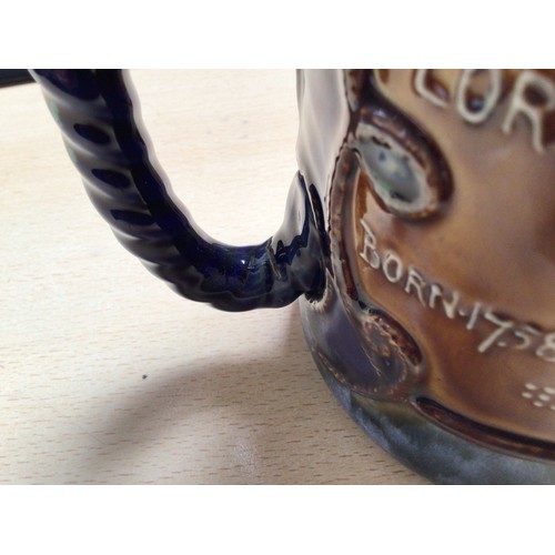 39 - A Royal Doulton two-handled loving-cup, ‘Nelson, England expects everyman to do his duty’, impressed... 