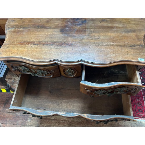 717 - An 18th Century mahogany commode chest of serpentine outline, with foliate gilt bronze mounts and es... 