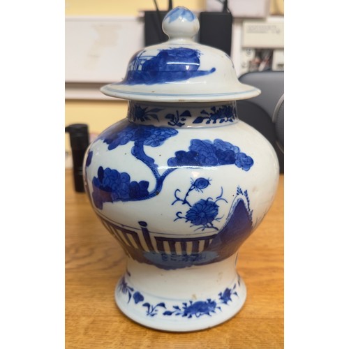 118 - A Chinese blue & white porcelain baluster vase and cover, painted with figures by a table and garden... 