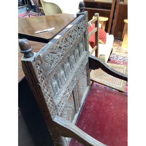 738 - An early 17th century oak Wainscott chair, the back with carved strapwork to top and middle rails, h... 