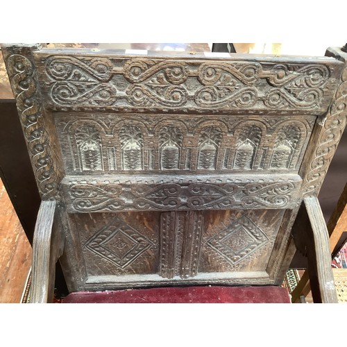 738 - An early 17th century oak Wainscott chair, the back with carved strapwork to top and middle rails, h... 