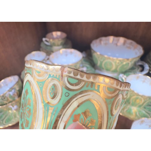 51 - An early 19th Century tea and coffee set, finely gilded on green and yellow grounds, no factory mark... 