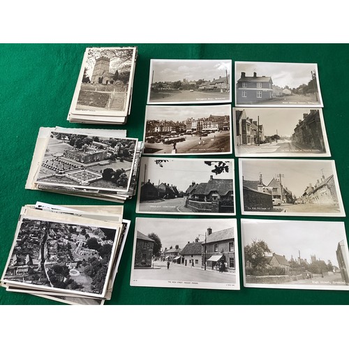 558 - Nearly 120 postcards of Northamptonshire, with some very good condition real photographic street sce... 