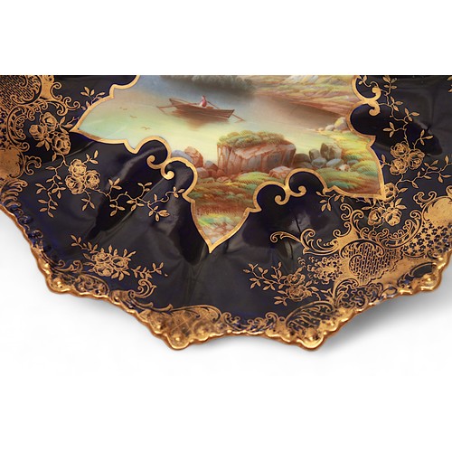 1 - A pair of Aynsley porcelain cabinet plates, each with shaped edge and with painted landscape studies... 