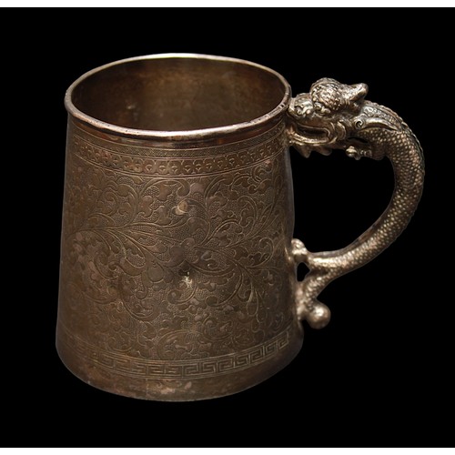 30 - A Chinese export white metal, tests as .800 grade or above silver tankard, in the manner of Wang Hin... 