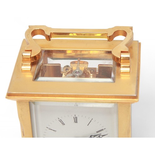 105 - A brass cased carriage clock by Garrard, London, the white enamel dial with Roman numerals denoting ... 