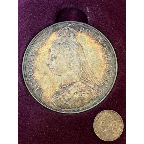 633 - A Queen Victoria Silver Jubilee Crown 1887, EF with toning, in fitted box together with a QV Silver ... 