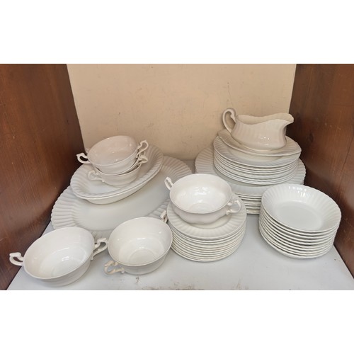 19 - A 40-piece Wedgwood part dinner service, of plain white and fluted design, comprising plates, side p... 