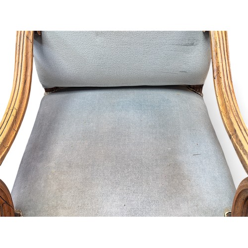 156 - A 19th century walnut Gainsborough chair, with blue velour upholstered seat and back, scrolled arms ... 