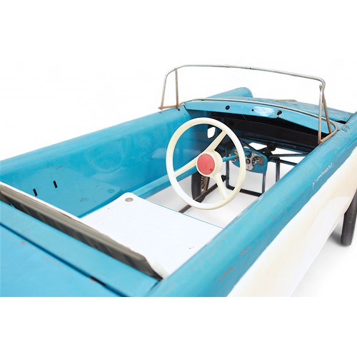 401 - A Tri-ang pedal car, C.1960’s, finished in blue and white, with applied metal branded badge to boot ... 