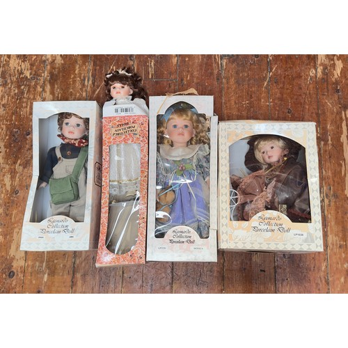 410 - A collection of approximately twenty vintage dolls, predominantly boxed porcelain dolls, comprising ... 