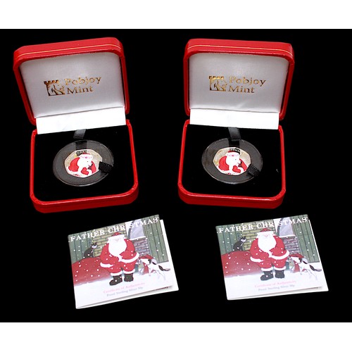 870 - Two limited edition Pobjoy Mint proof sterling silver Father Christmas 50p coins, in clear plastic c... 