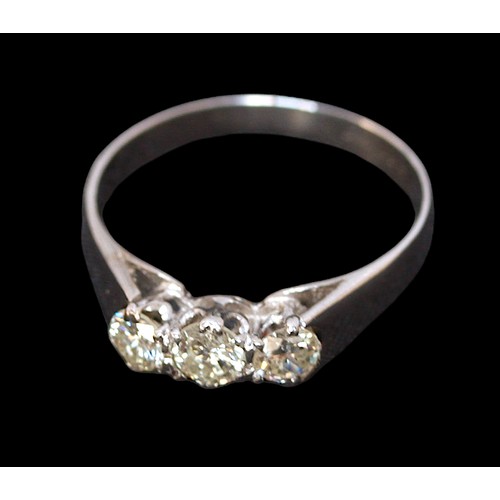 73 - An 18ct white gold diamond ring, set with three round brilliant cut diamonds in a claw setting, esti... 