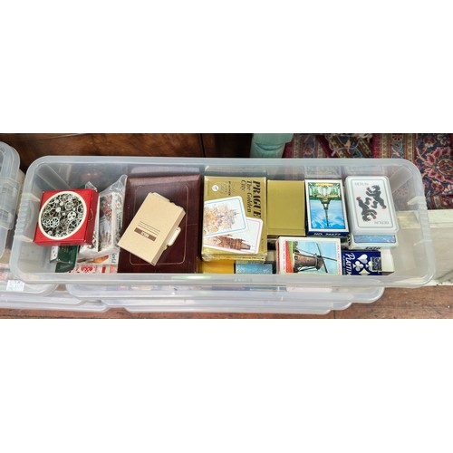 295 - An extensive collection of assorted playing cards across nine plastic boxes, including ‘Bell’s’ play... 