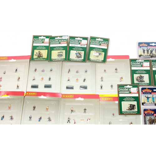 483 - A collection of forty-eight ‘OO’ scale model railway figure sets, comprising Hornby, Bachmann Branch... 