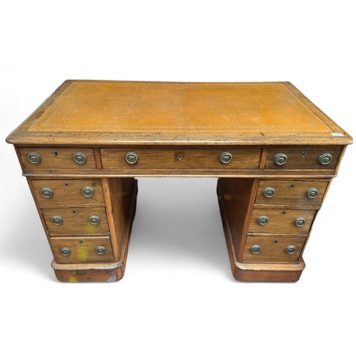 189 - A 19th century mahogany pedestal desk, of small proportions, the tan, gilt-tooled leather scribe abo... 