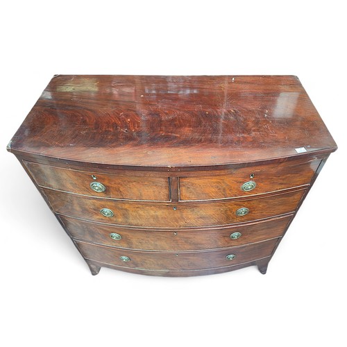 181 - A Victorian mahogany bow-front chest of two short, over three long graduated drawers with circular b... 