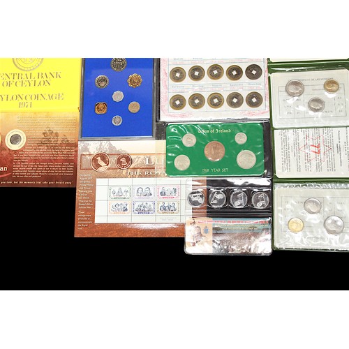 795 - A collection of foreign coins including Genghis Khan copper hammered coin circa 1200 struck with an ... 