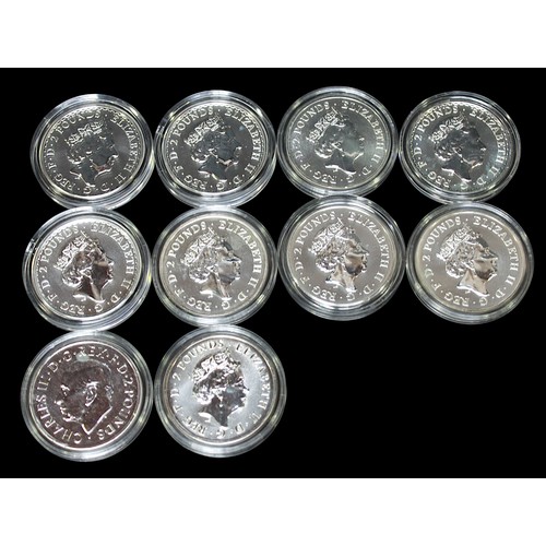 790 - Ten assorted 1oz .999 fine silver £2 coins. Each in clear plastic capsule.