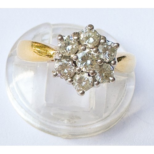 55 - An 18ct yellow gold daisy cluster diamond ring, claw set with 7 x round brilliant cut diamonds, tota... 