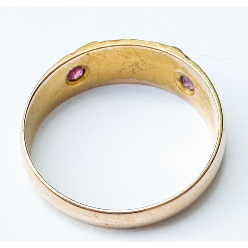 69 - A 15ct yellow gold dress ring, set with seed pearls and rubies, weighs 2.3 grams, hallmarked 1892.