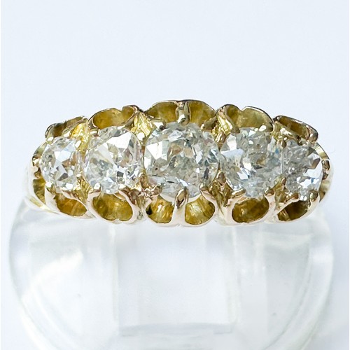 70 - An 18ct yellow gold dress ring, set with five Victorian cut diamonds in a gypsy-style setting, estim... 