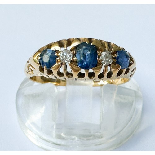 71 - An 18ct yellow gold gypsy-style ring, set with three sapphires and two diamonds, ring weighs 2.6 gra... 