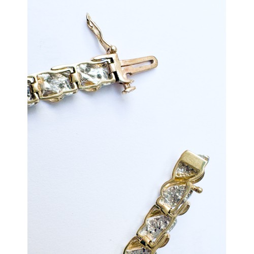 80 - A 9ct yellow gold bracelet, set with fifty-six small diamonds in a bar and wave design, bracelet  we... 