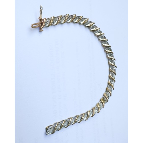 80 - A 9ct yellow gold bracelet, set with fifty-six small diamonds in a bar and wave design, bracelet  we... 