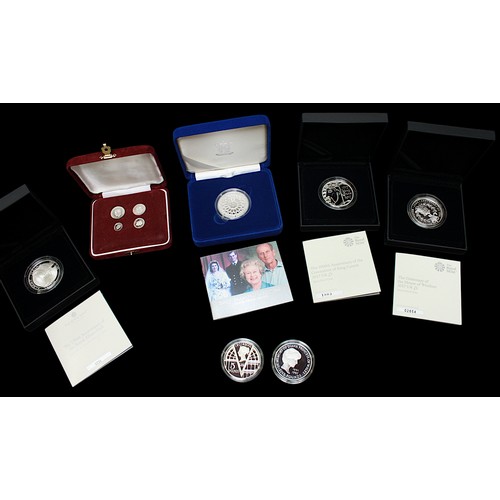 819 - Six assorted silver crowns including Royal Mint ‘Viking Conqueror, English King’, a 2007 ‘Diamond We... 