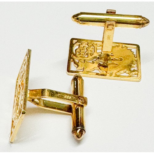 82 - A pair of 14ct yellow gold cufflinks, depicting a traditional dragon with Chinese symbols, with bato... 