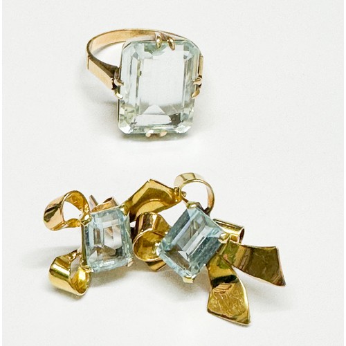 91 - An 18ct yellow gold dress ring, claw set with a oblong-shaped pale faceted aquamarine, measuring mm,... 