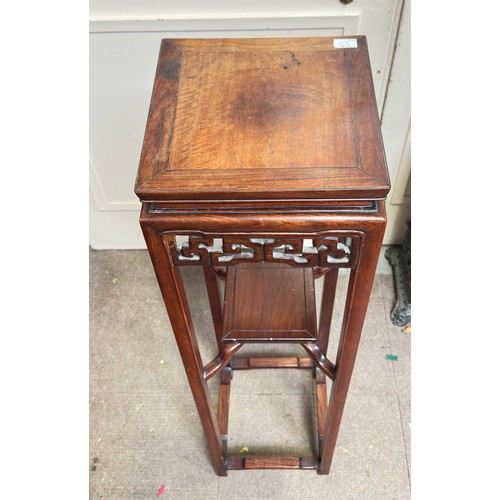 186 - A Chinese hardwood jardinière stand, with square top and under-tier, pierced and carved frieze, rais... 