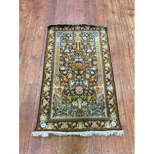 133 - A hand-knotted prayer rug with Mihrab worked with a tree of life and birds amidst branches, 158cm x ... 