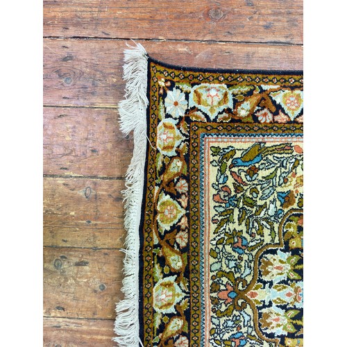 133 - A hand-knotted prayer rug with Mihrab worked with a tree of life and birds amidst branches, 158cm x ... 