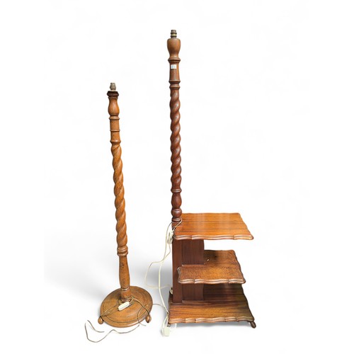 129 - Two 20th Century South African hardwood barley-twist floor standing lamps, one example with integral... 