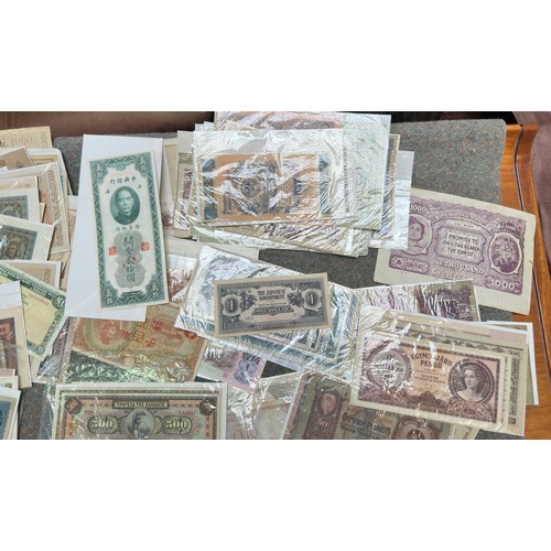 851 - A good quantity of used world banknotes, including an 1882 Stockton-on-Tees Five Pounds (AF with pie... 