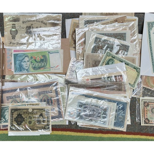 851 - A good quantity of used world banknotes, including an 1882 Stockton-on-Tees Five Pounds (AF with pie... 