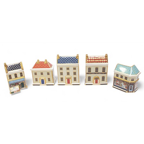 271 - Five assorted Royal Crown Derby paperweights modelled as shops and houses, each with white stopper, ... 