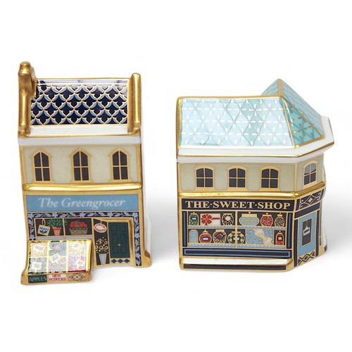 271 - Five assorted Royal Crown Derby paperweights modelled as shops and houses, each with white stopper, ... 